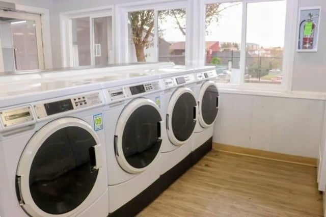 Row of white front load washing machines laundry room at Cougar Ridge Apartments in Pullman Student Accommodation