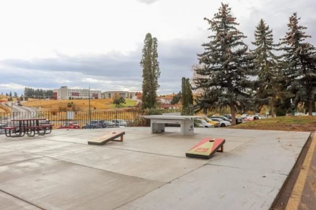 Picnic tables ping pong and cornhole games playing area at Cougar Ridge Apartments in Pullman Student Accommodation