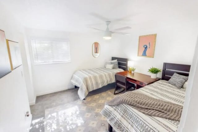 Two beds and desks in a bedroom at Glenwood Apartments in Provo Student Accommodation