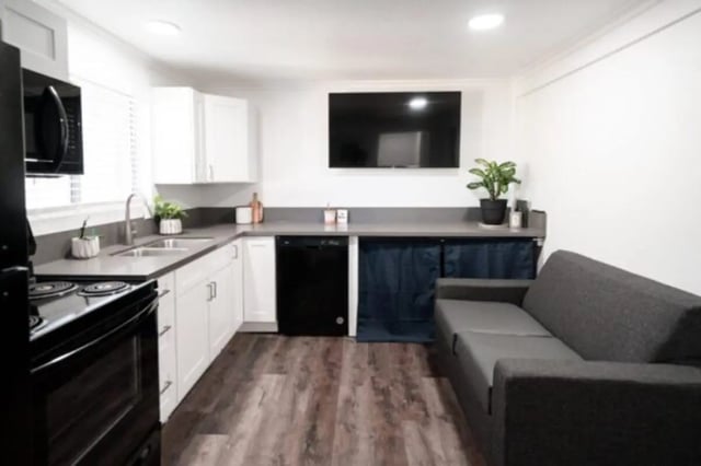 Kitchenette with couch and TV living area at Glenwood Apartments in Provo Student Accommodation