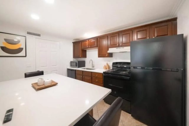 White counter stove refrigerator and cabinets kitchen at Glenwood Apartments in Provo Student Accommodation