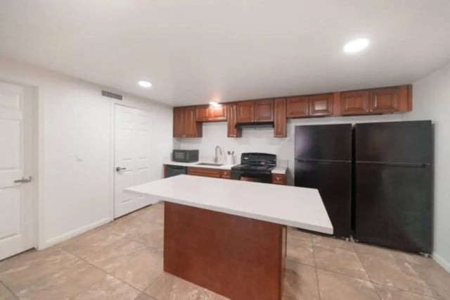 Kitchen with island cabinets appliances and refrigerators kitchen at Glenwood Apartments in Provo Student Accommodation