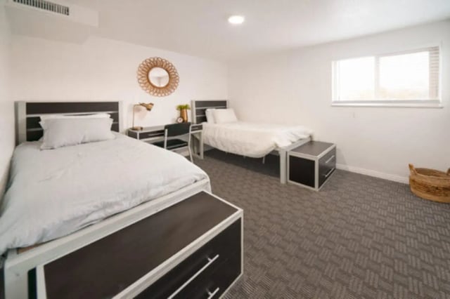 Two beds desks mirror and woven basket bedroom at Glenwood Apartments in Provo Student Accommodation