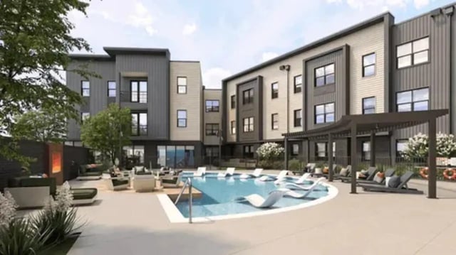 Modern building with pool lounge chairs exterior at Global College Station in College Station Student Accommodation