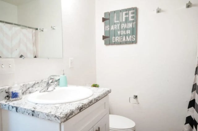 Sink mirror and toilet Bathroom at Apple Lane Apartments in Lawrence Student Accommodation