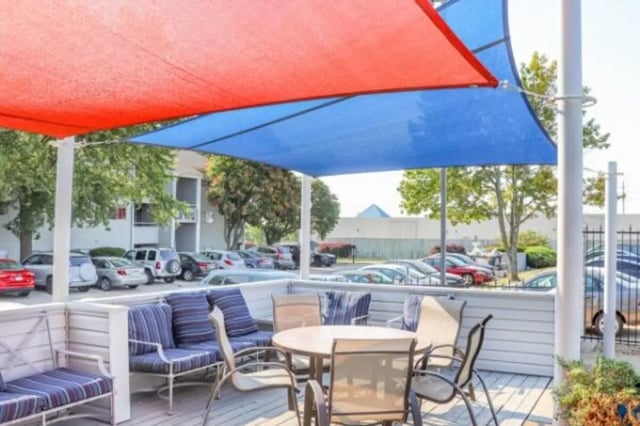 Outdoor seating with lounge chairs and table Exterior at Apple Lane Apartments in Lawrence Student Accommodation