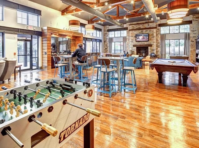 Foosball table pool table bar and seating common area at The Province in Louisville Student Accommodation