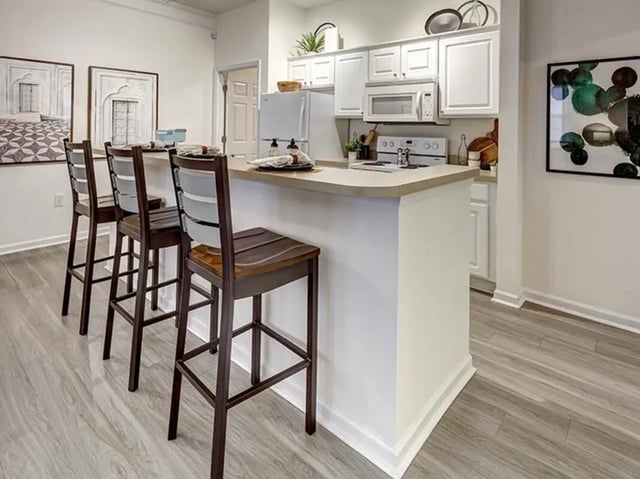 Bar stools at kitchen island and cabinets kitchen at The Province in Louisville Student Accommodation