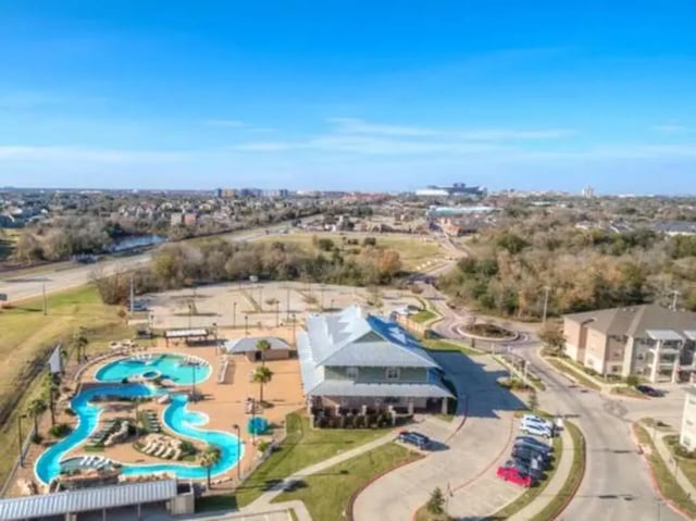 Resort style pool and buildings exterior at Campus Village Apartments in College Station Student Accommodation