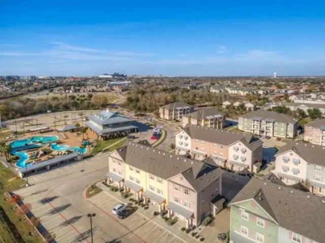 Apartment complex with pool and parking exterior at Campus Village Apartments in College Station Student Accommodation