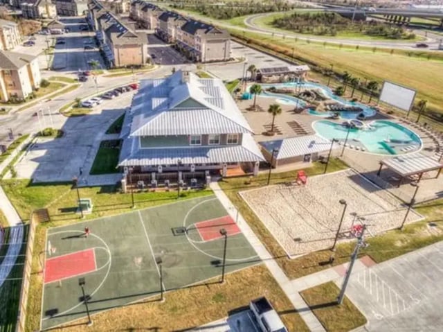 Aerial view of basketball court pool and housing exterior at Campus Village Apartments in College Station Student Accommodation