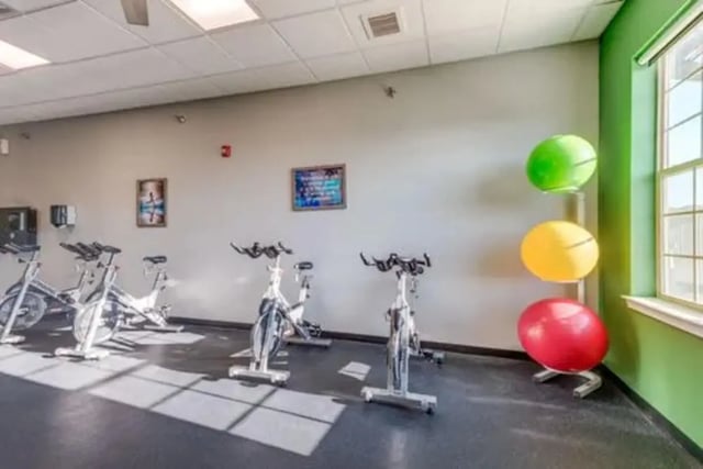 Exercise bikes stacked exercise balls fitness room at Campus Village Apartments in College Station Student Accommodation