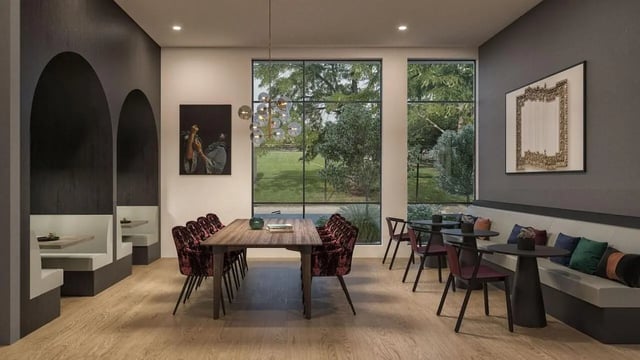 Dining area with booths, tables, and plush chairs communal area at The Dorsey in Denver Student Accommodation