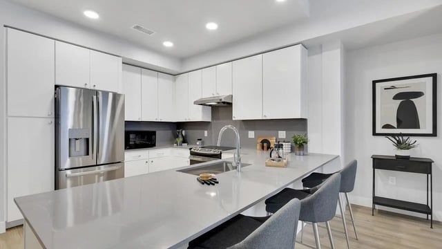 Modern kitchen with stainless steel appliances and island kitchen at The Dorsey in Denver Student Accommodation