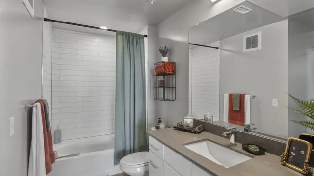 Modern bathroom with subway tile shower and vanity bathroom at The Dorsey in Denver Student Accommodation