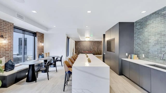 Large counter with bar stools and pool table area. at The Dorsey in Denver Student Accommodation