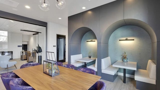 Dining table booths glass office residential common area at The Dorsey in Denver Student Accommodation