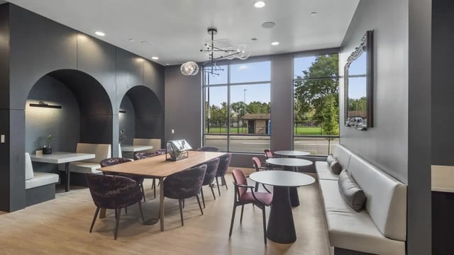 Dining tables booth seating and lounge seating common area at The Dorsey in Denver Student Accommodation