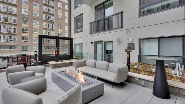 Sofa fire pit chairs table exterior at The Dorsey in Denver Student Accommodation