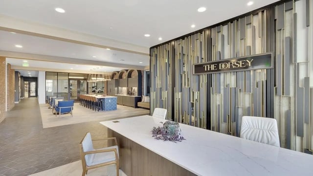 Reception desk and chairs communal area lounge at The Dorsey in Denver Student Accommodation