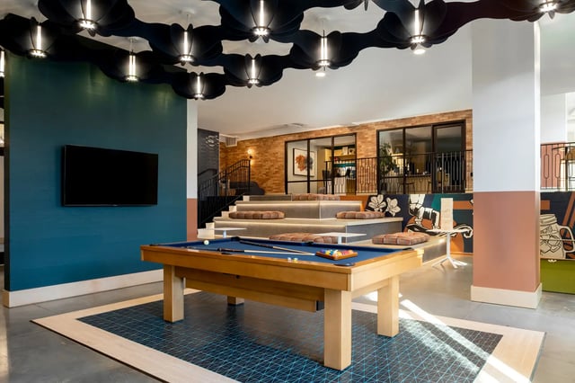 Pool table and tiered seating common area at Dockside Clemson in Clemson Student Accommodation