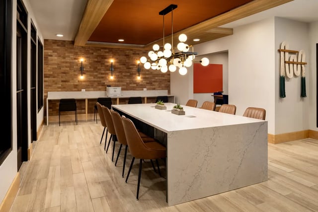 Table chairs wall outlet study area. at Dockside Clemson in Clemson Student Accommodation