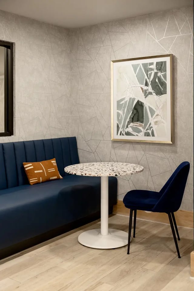Blue booth table and chair common area at Dockside Clemson in Clemson Student Accommodation