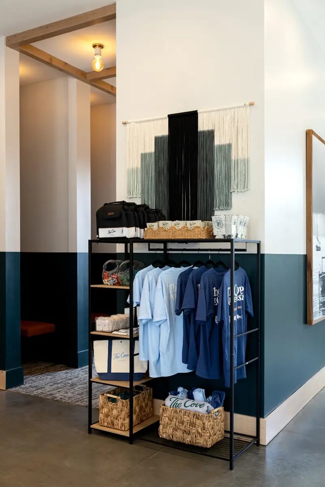 Display rack with t-shirts and bags Retail Area at Dockside Clemson in Clemson Student Accommodation