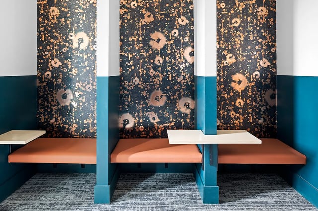 Three booths with orange seats and tables communal area at Dockside Clemson in Clemson Student Accommodation