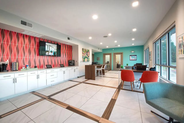 Coffee bar with seating and tables common area at Campus Vue Apartments in Houston Student Accommodation