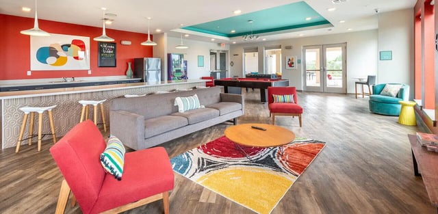 Sofa pool table seating living room at Campus Vue Apartments in Houston Student Accommodation