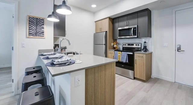 Island seating with modern appliances kitchen at Union Grantville in San Diego Student Accommodation