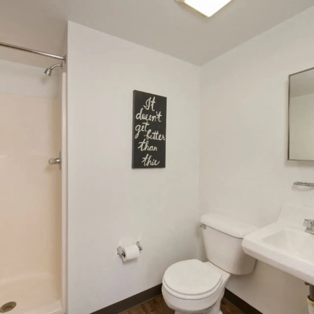 Shower toilet sink and inspirational sign bathroom at Domain at Cleveland in Cleveland Student Accommodation