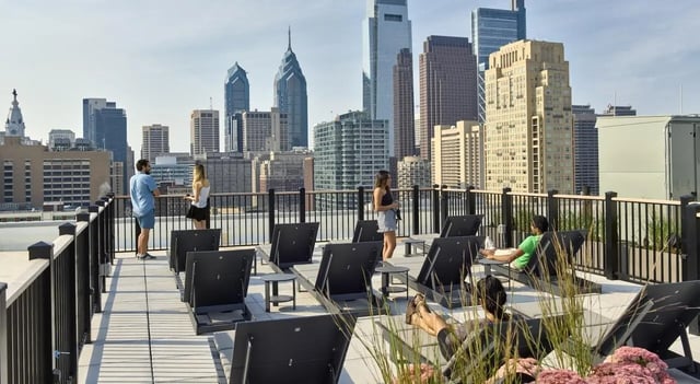 Rooftop lounge chairs with city view exterior at The Hamilton in Philadelphia Student Accommodation