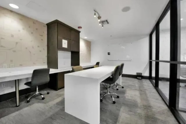 Desks chairs cabinets whiteboard study area at GrandMarc Austin in Austin Student Accommodation