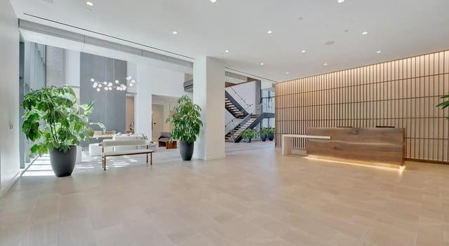 Modern lobby with plants and reception desk Lobby at The Chestnut in Philadelphia Student Accommodation