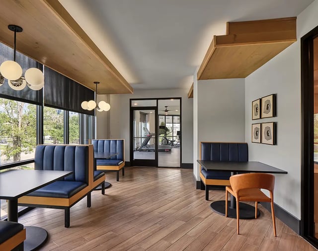 Blue booths tables gym visible lounge area at Flatiron in Baton Rouge Student Accommodation