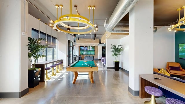 Pool table bar stools and television common area at Flatiron in Baton Rouge Student Accommodation