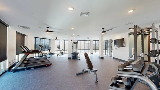 Treadmills ellipticals dumbbells weight rack gym. at Flatiron in Baton Rouge Student Accommodation