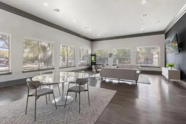 Round table chairs couches tv living room at Mirage San Marcos in San Marcos Student Accommodation