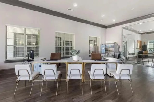 Eight white chairs at desks with computers study area at Mirage San Marcos in San Marcos Student Accommodation