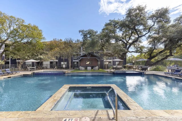 Pool and hot tub with lounge chairs exterior at Mirage San Marcos in San Marcos Student Accommodation