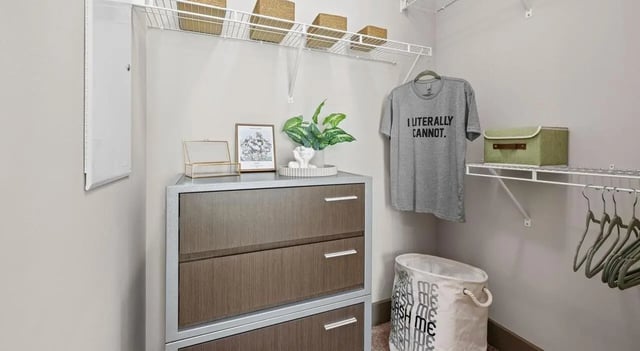 Drawer chest with t-shirt and laundry bin closet at Accolade Athens in Athens Student Accommodation