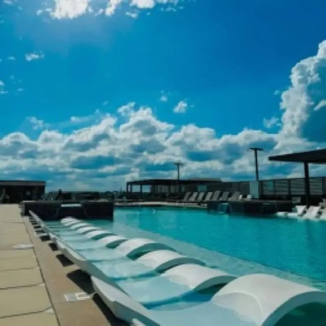 Infinity pool with lounge chairs exterior at Accolade Athens in Athens Student Accommodation