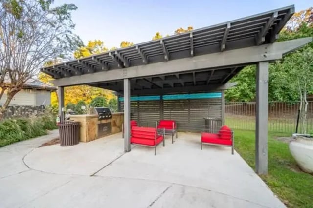 Outdoor kitchen grill red seating patio area at Flatts at South Campus in Oxford Student Accommodation