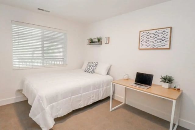 Bed desk and laptop bedroom at Fleur De Lis Apartments in Provo Student Accommodation