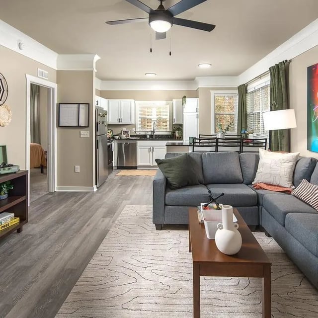 Living area with sectional sofa and kitchen living room at Highpointe in Boone Student Accommodation