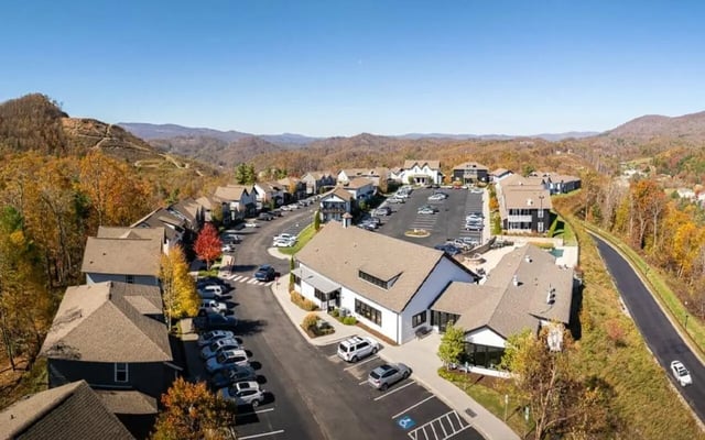 Apartment buildings with parking lot and cars exterior at Highpointe in Boone Student Accommodation
