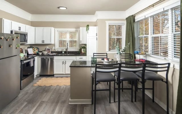 Kitchen with stainless steel appliances bar seating kitchen at Highpointe in Boone Student Accommodation