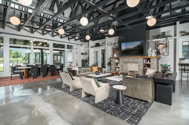 Modern common area with lounge and dining seating. at Highpointe in Boone Student Accommodation